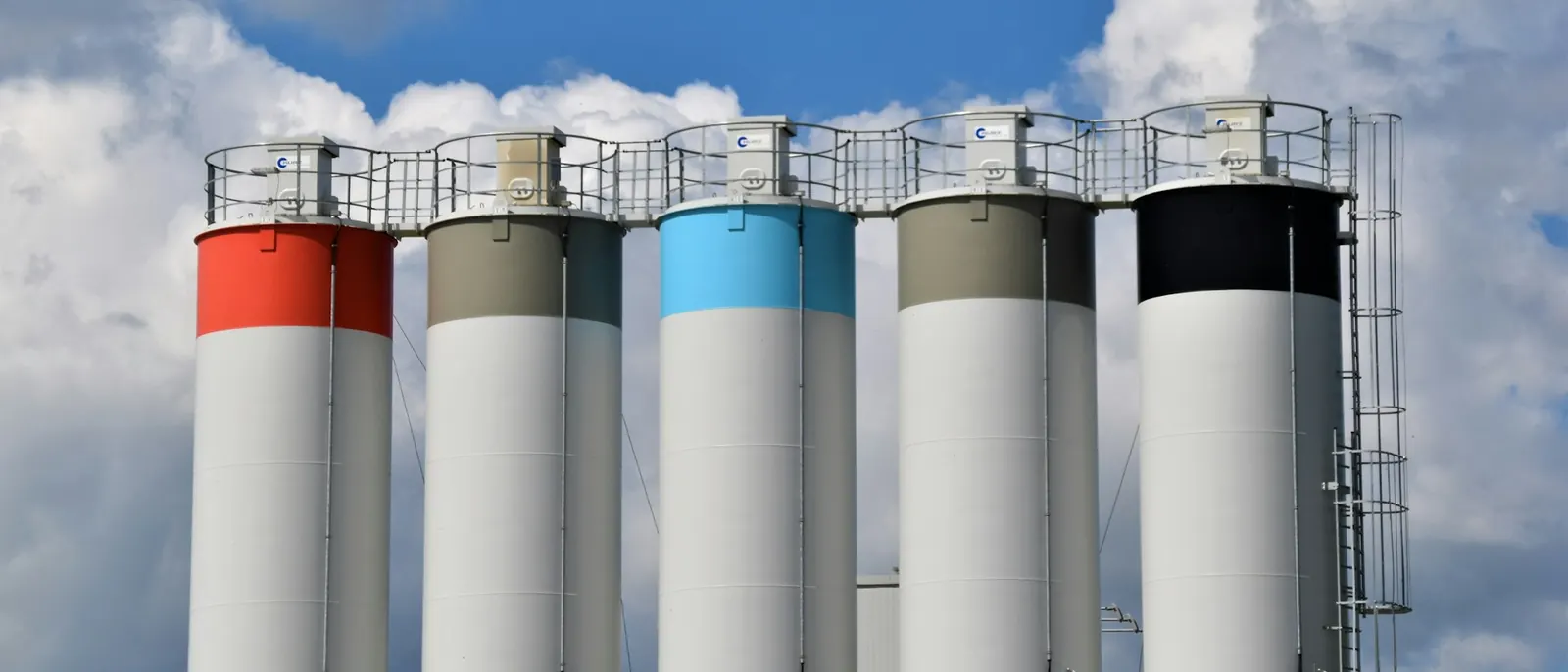 Row of bulk storage silos